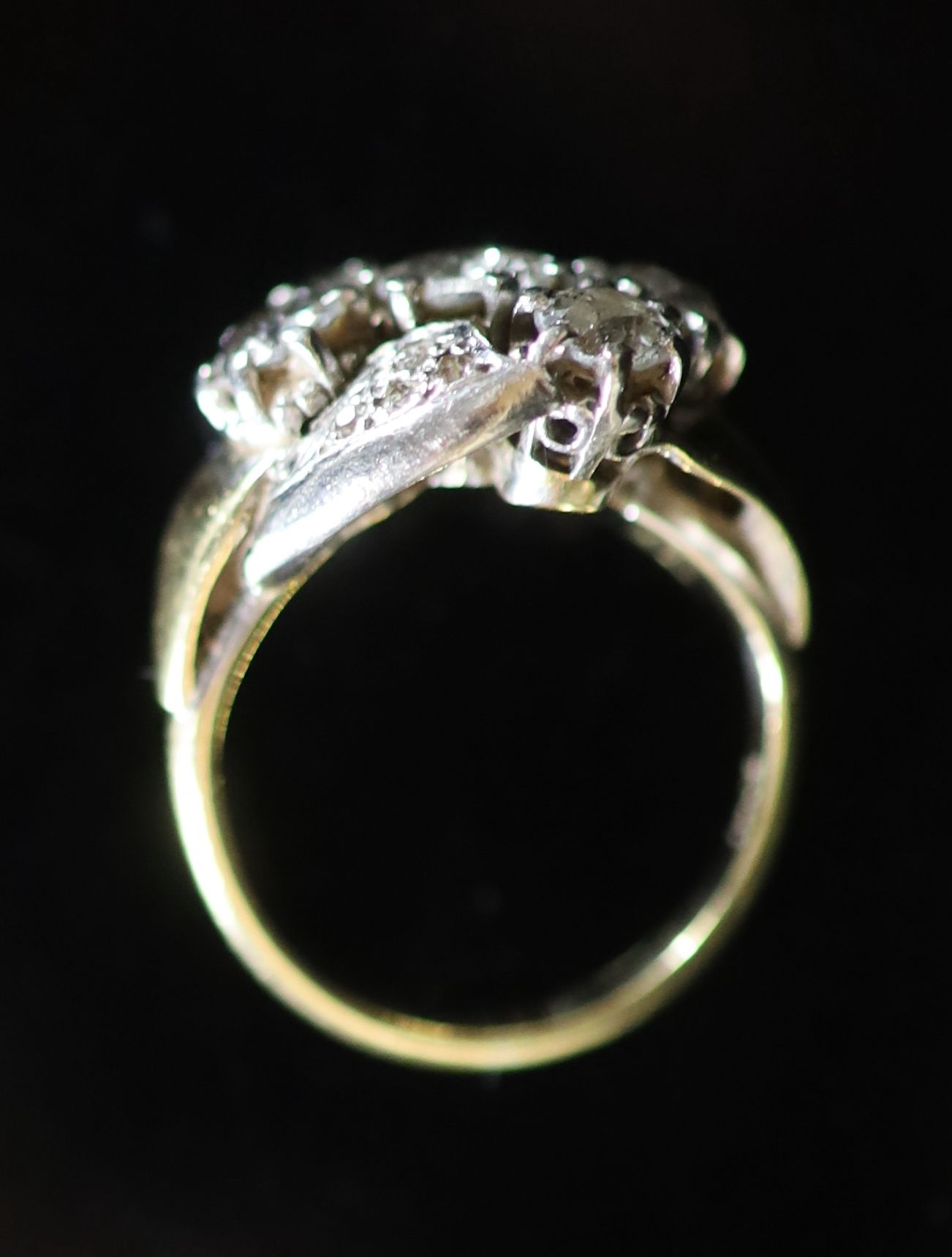 A mid 20th century 18ct gold and five stone diamond cluster ring